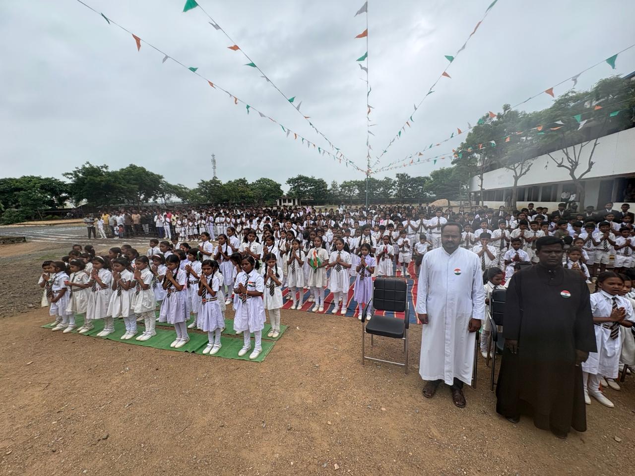 Students gathered in a supervised assembly on the Carmel school campus