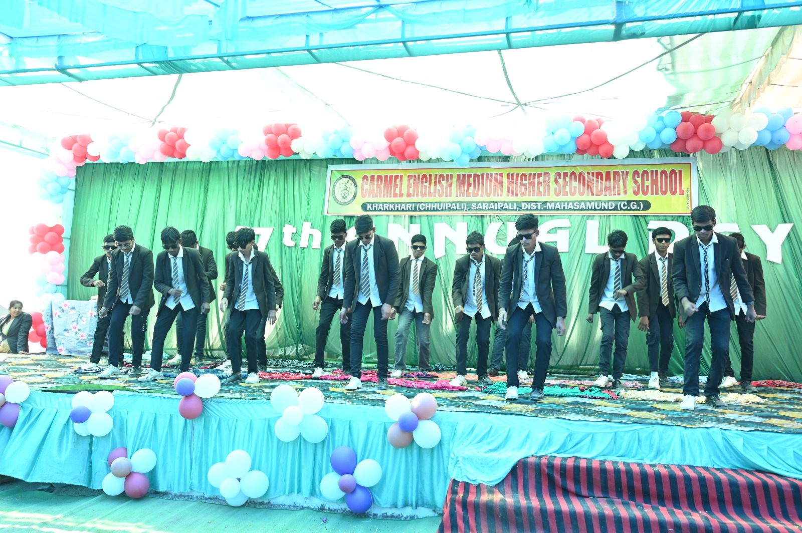 Student group performing a cultural dance on stage