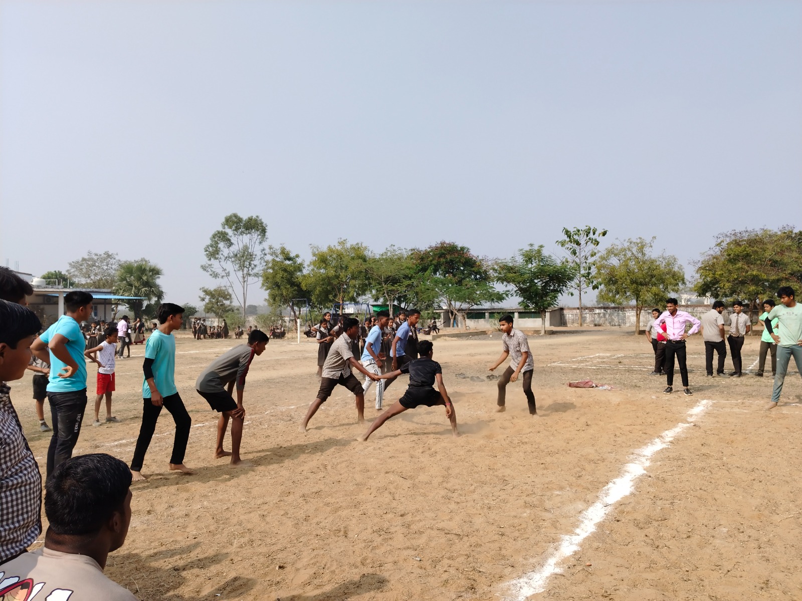 Students playing a game together on the Carmel school campus